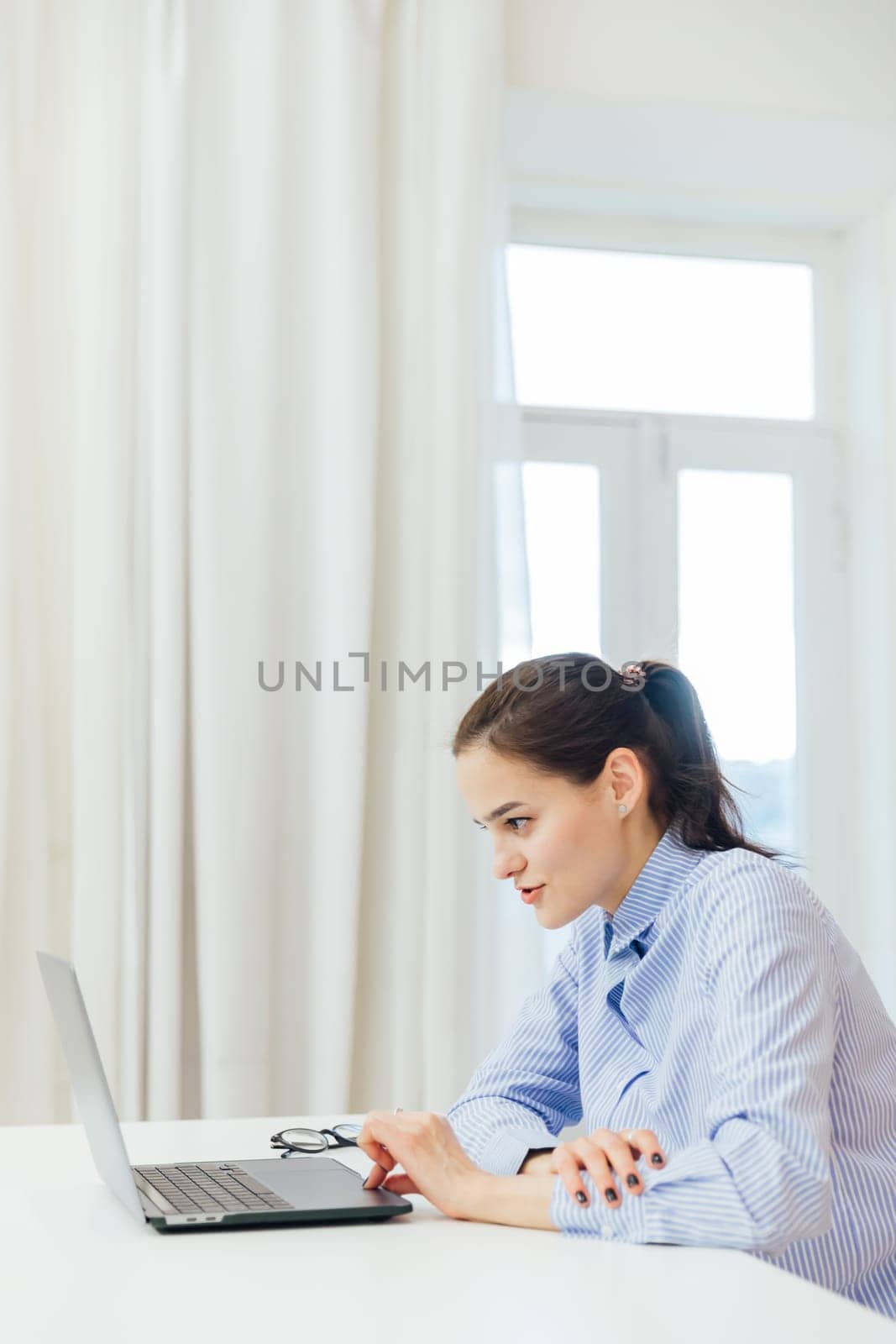 remote work woman communicates via skype online communication internet by Simakov