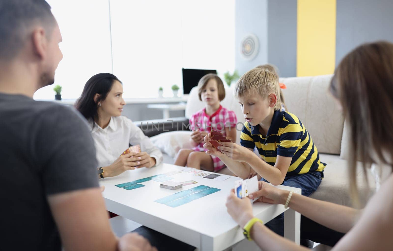 Children spend time with parents, mother entertain kids with games on holiday by kuprevich