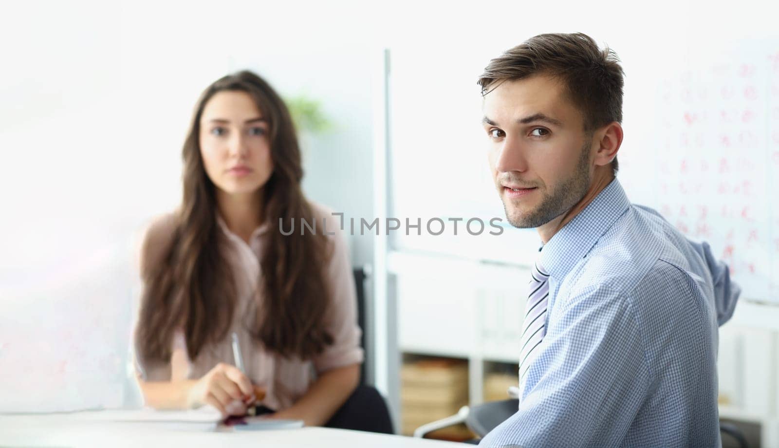 Man business employee on workplace, clerk look in camera on conference meeting by kuprevich