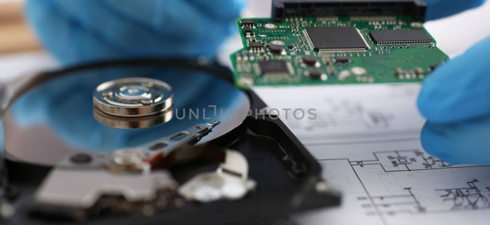 Close-up of male technician hold computer details, try to fix or collect device, dvd disc. Repair service, handyman, service, technology, fixation concept