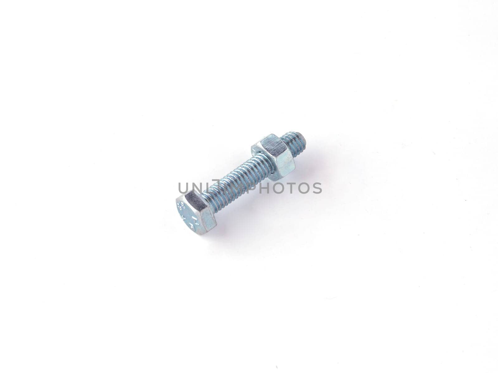 Nut and bolt on a white background.