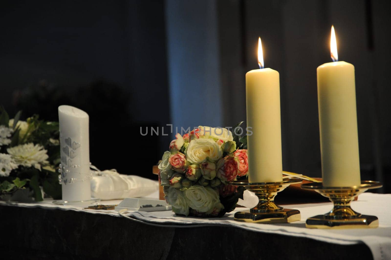 Bridal bouquet and candlelight