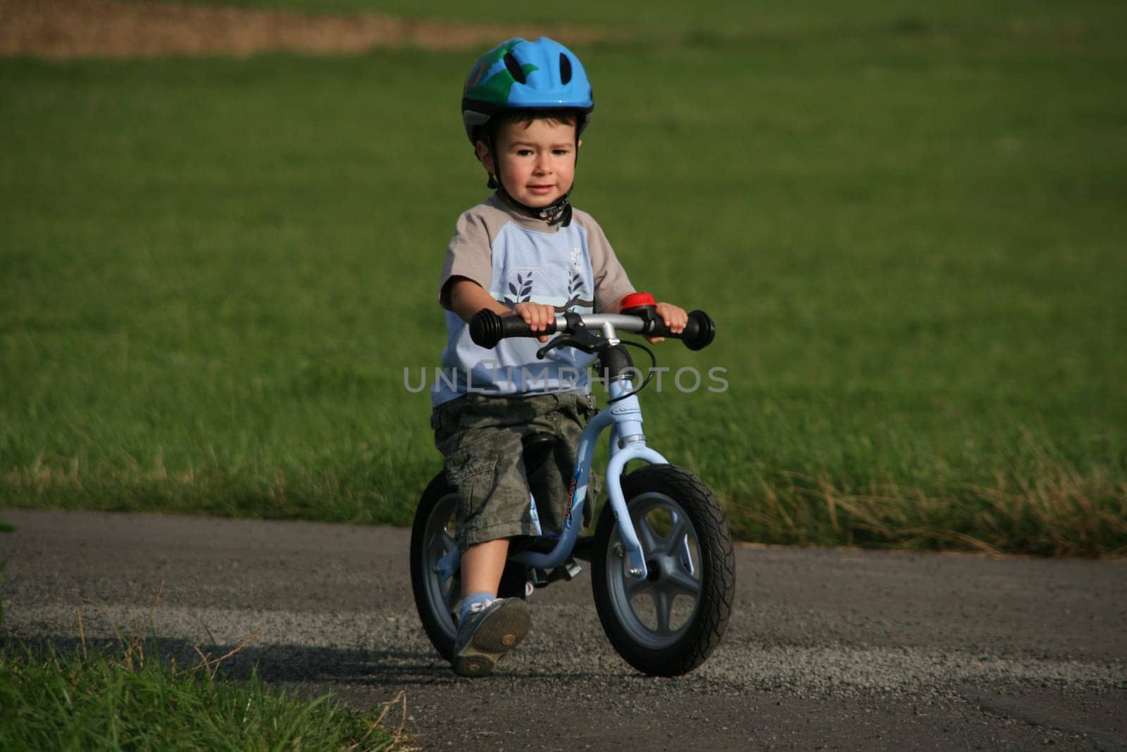 Child on balance bike