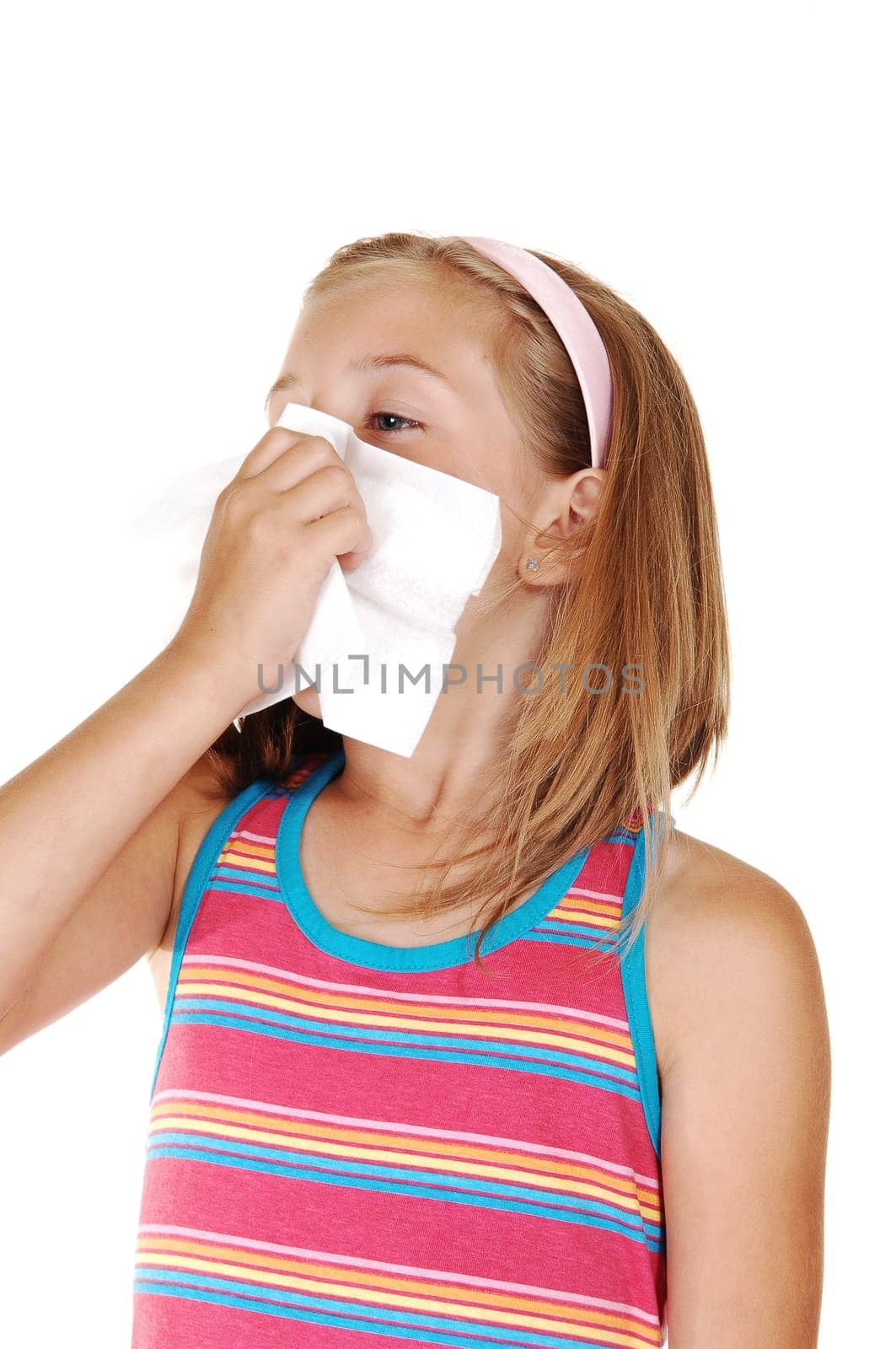 Young girl sneezing.