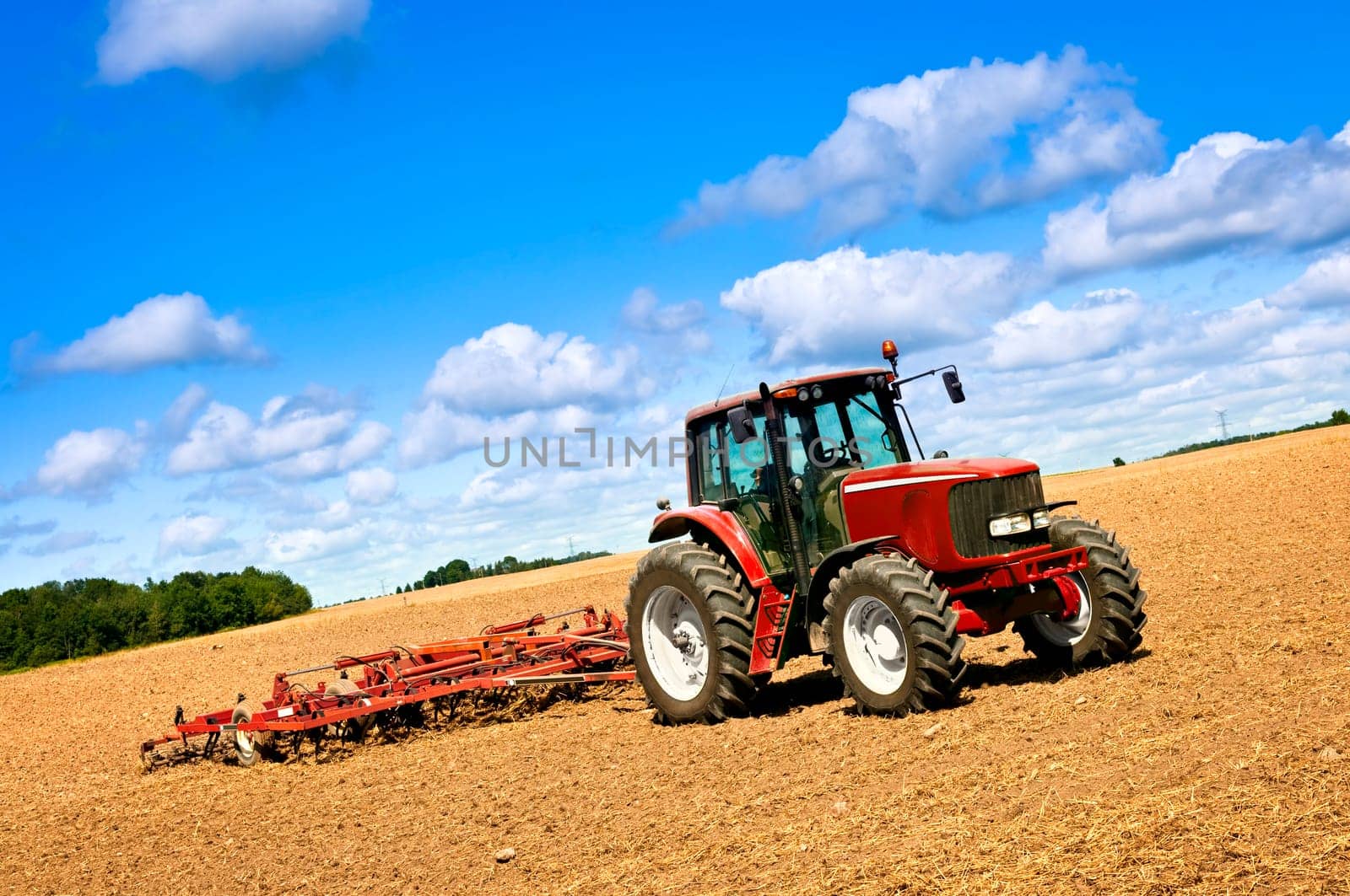 Tractor in plowed field