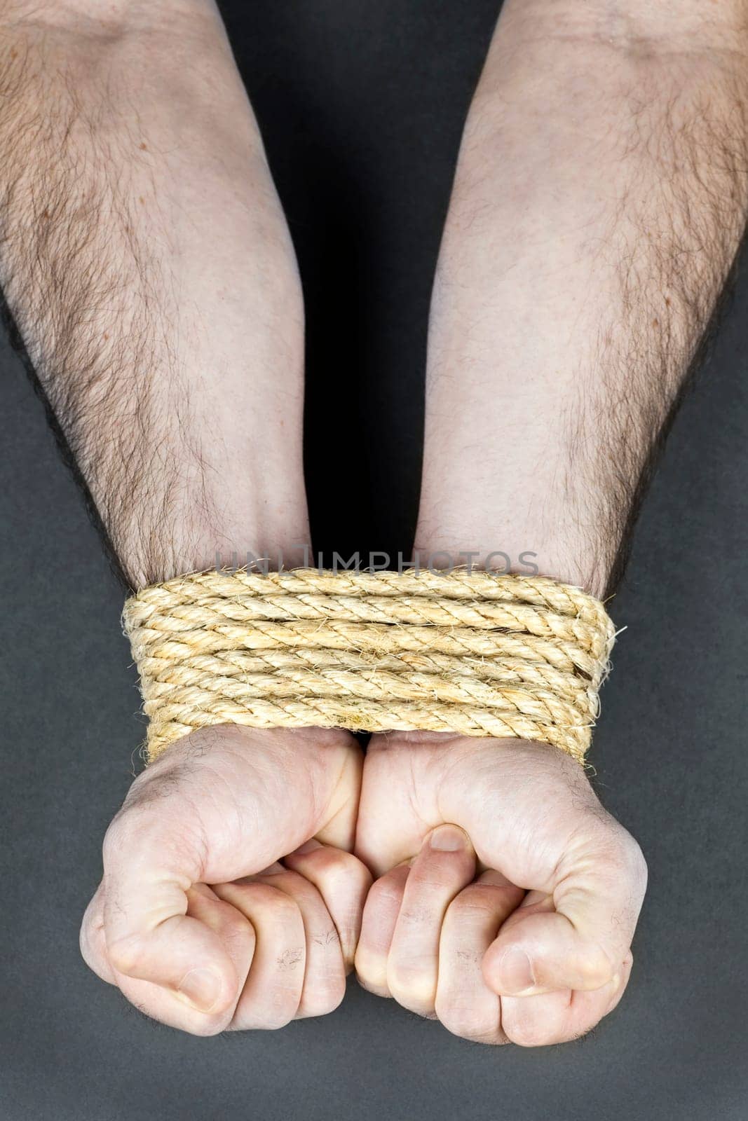 Wrists tied with rope