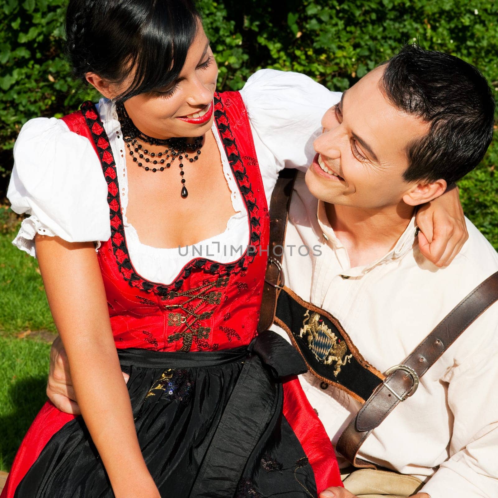 Couple in traditional costume - dirndl and lederhosen