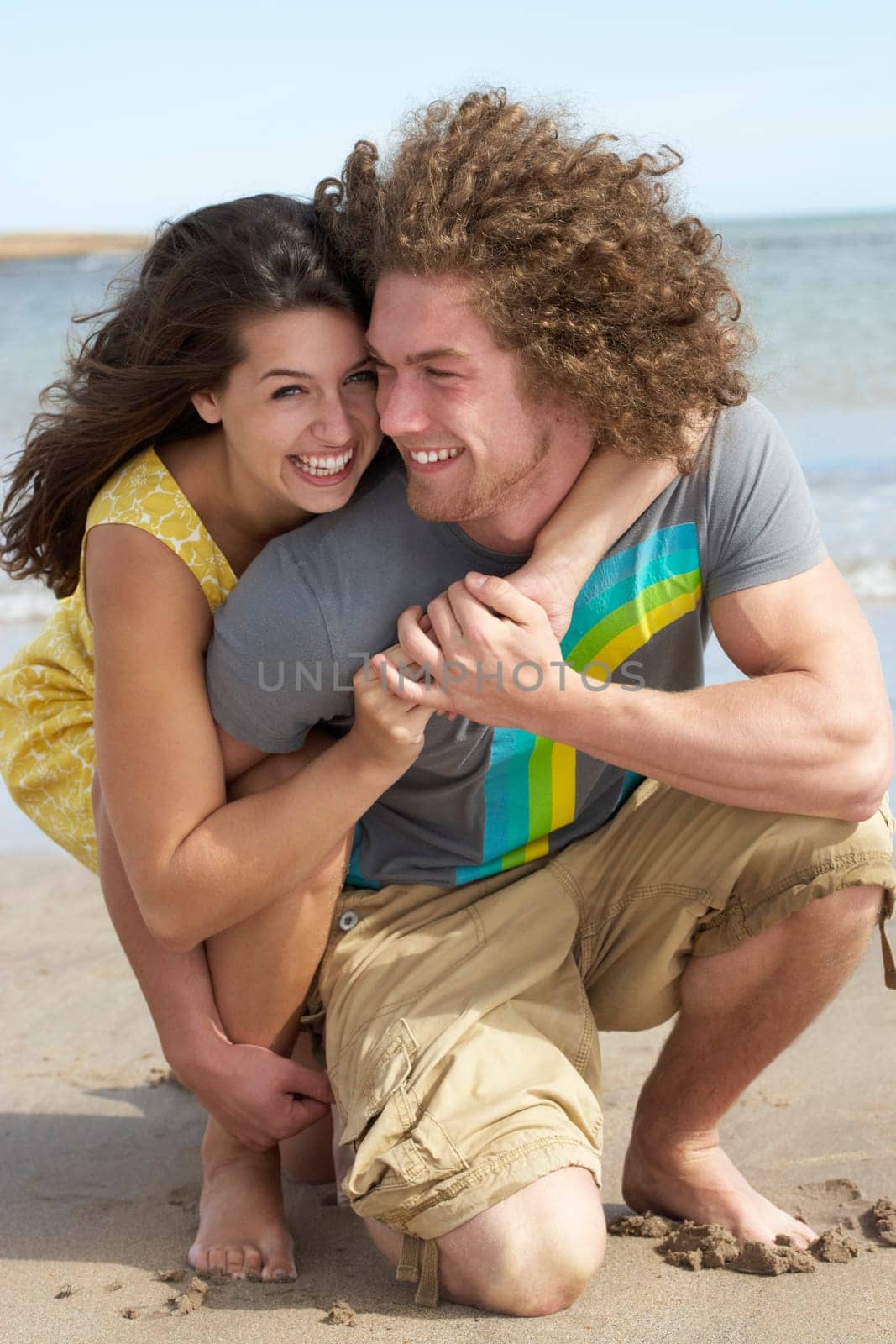 Affectionate Young Couple Having Fun On Beach