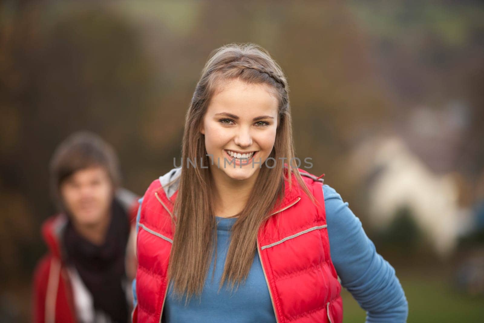 Teenage Girl Outside With Boyfriend In Background