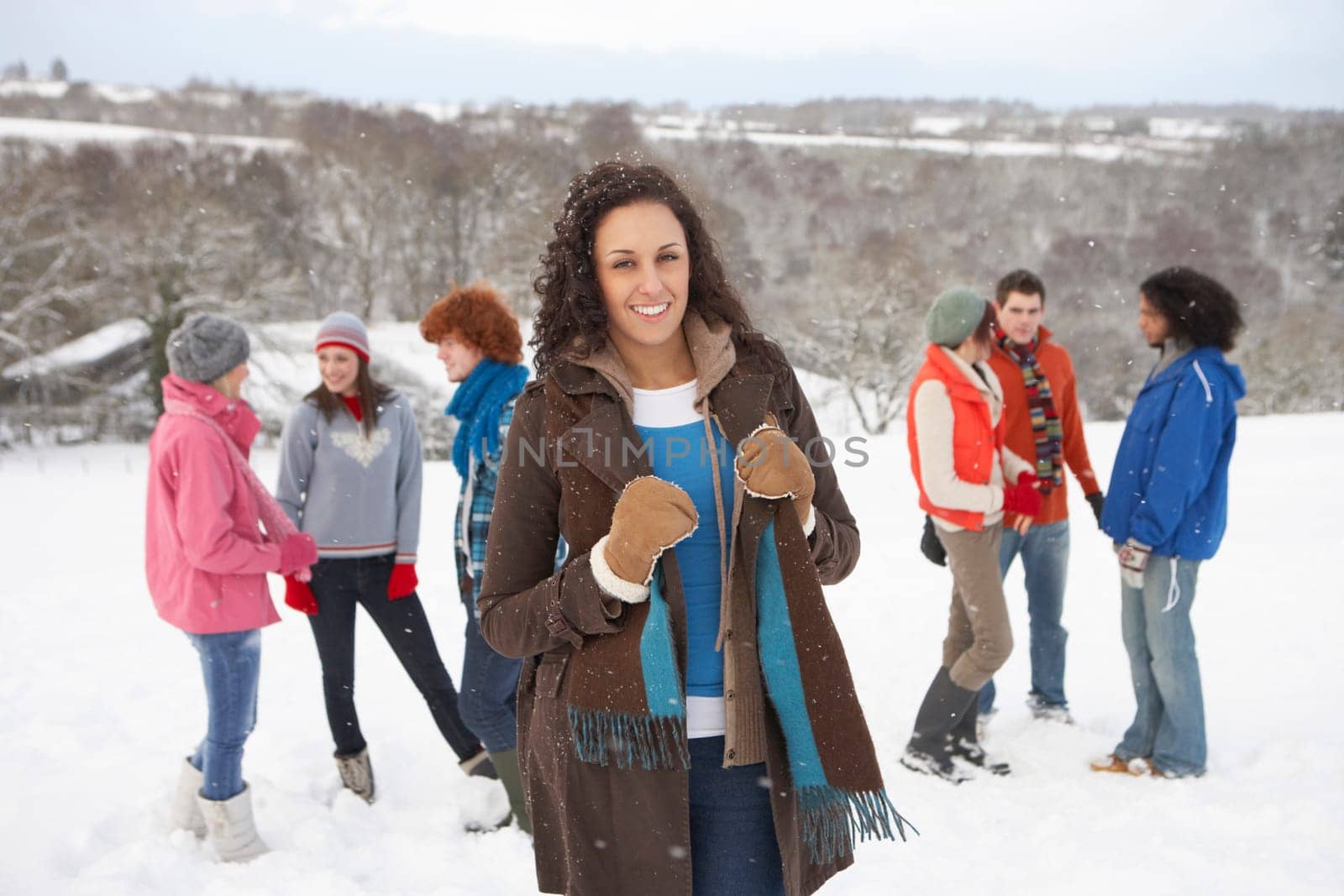 Group Of Young Friends Having Fun In Snowy Landscape