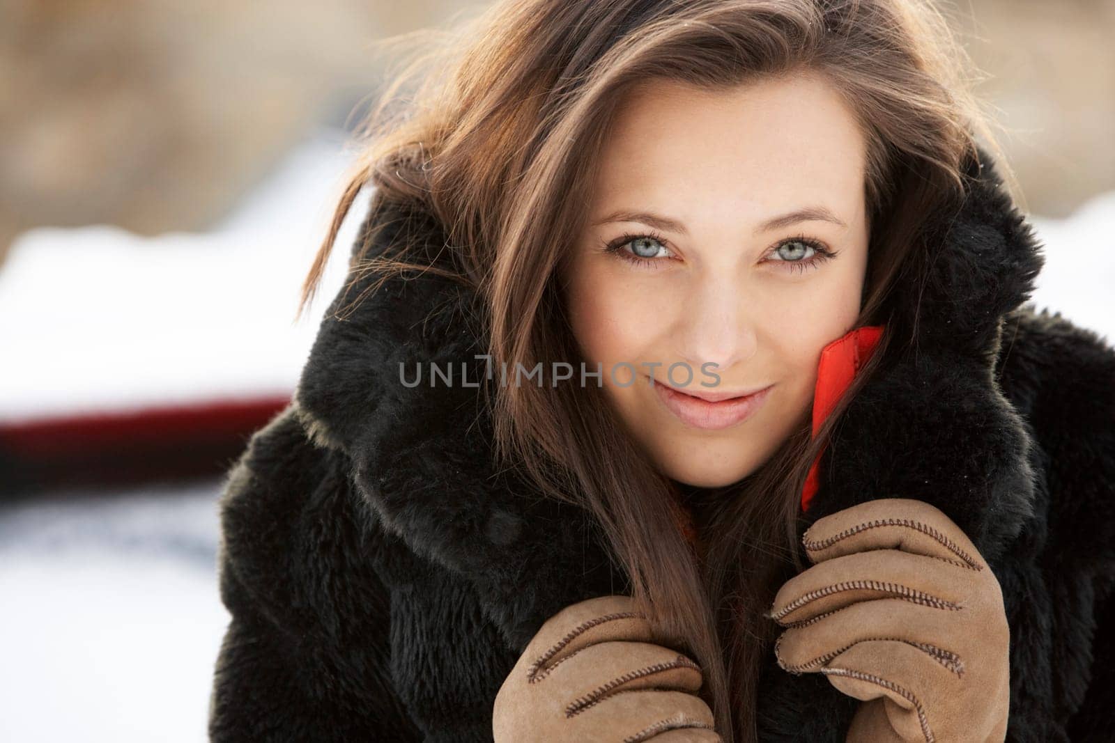Close Up Of Teenage Girl Wearing Fur Coat In Snowy Landscape