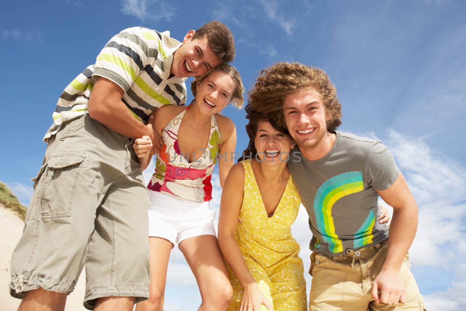 Group Of Friends Having Fun On Summer Beach
