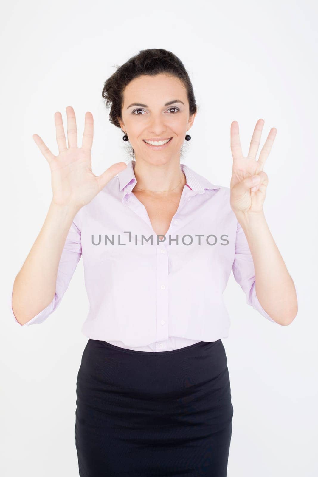 Woman showing the number 8 with eight fingers