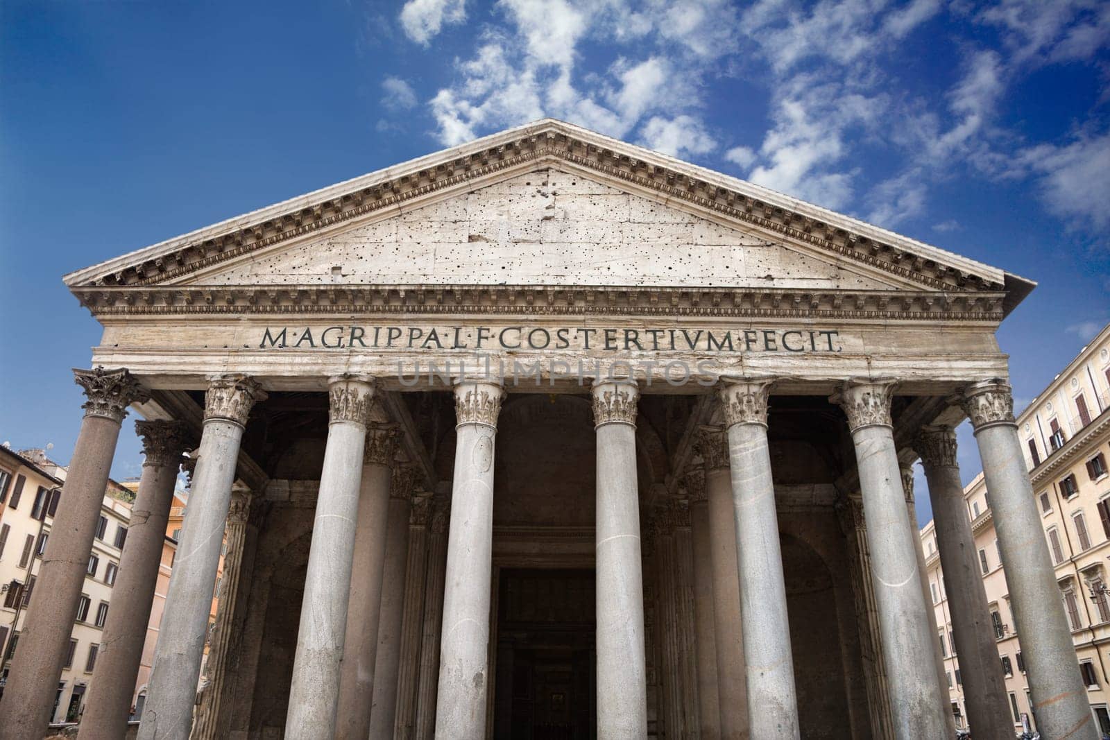 Low angle view of columns and front facade of the Pantheon. Horizontal shot.