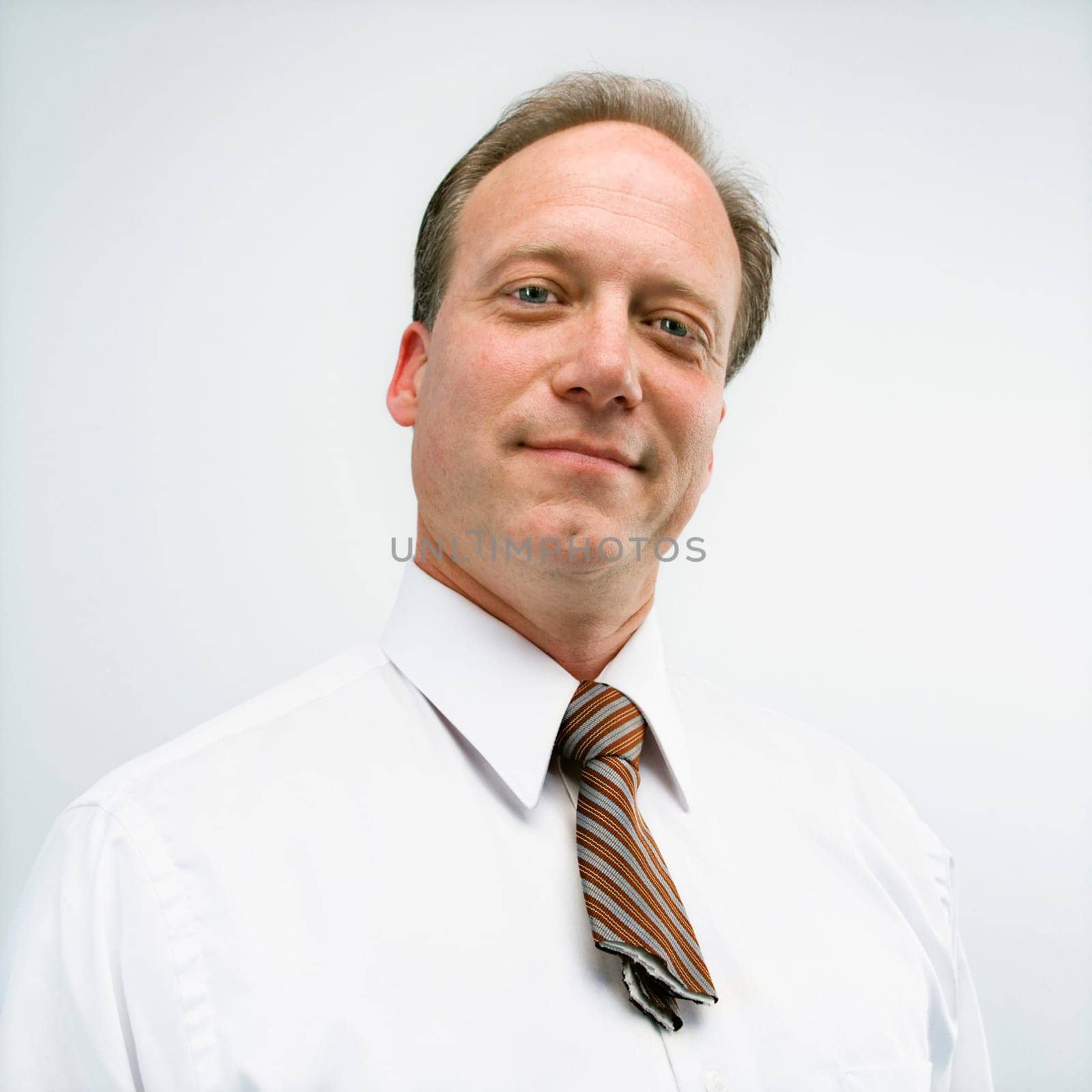 Caucasian middle aged businessman portrait with cut necktie.