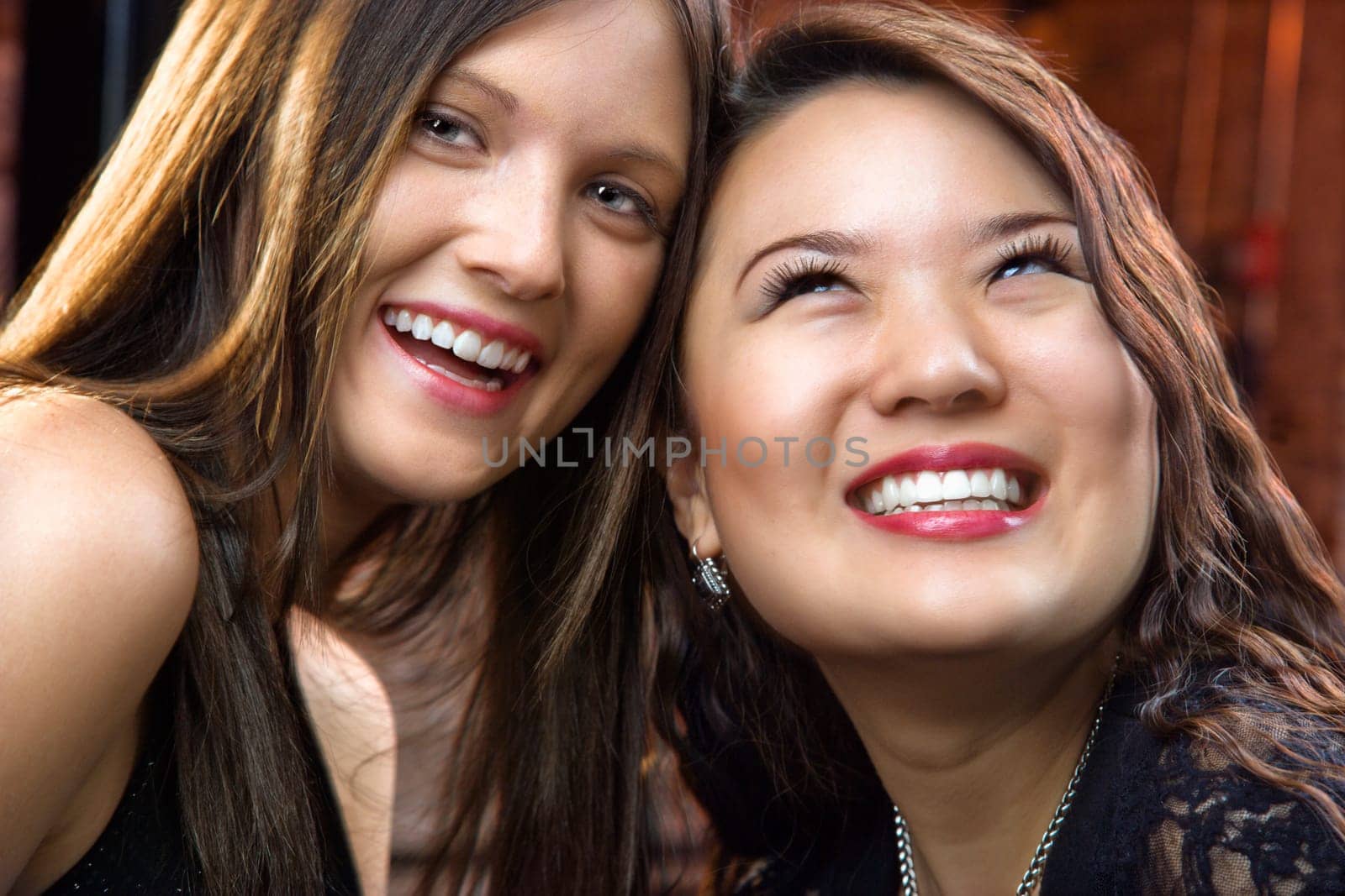 Portrait of two pretty smiling young women.