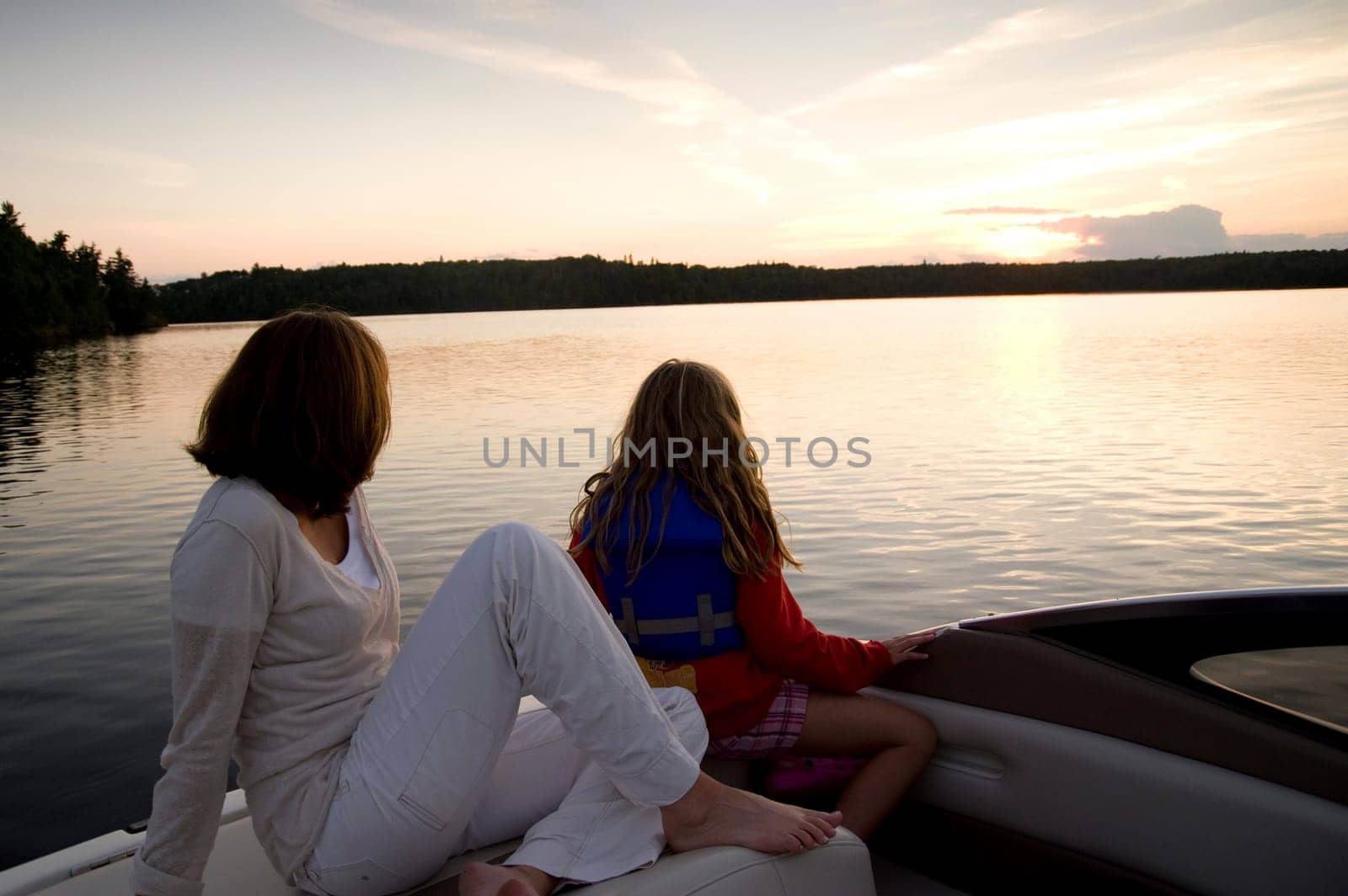 Enjoying sunset from boat, Lake of the Woods, Ontario, Canada