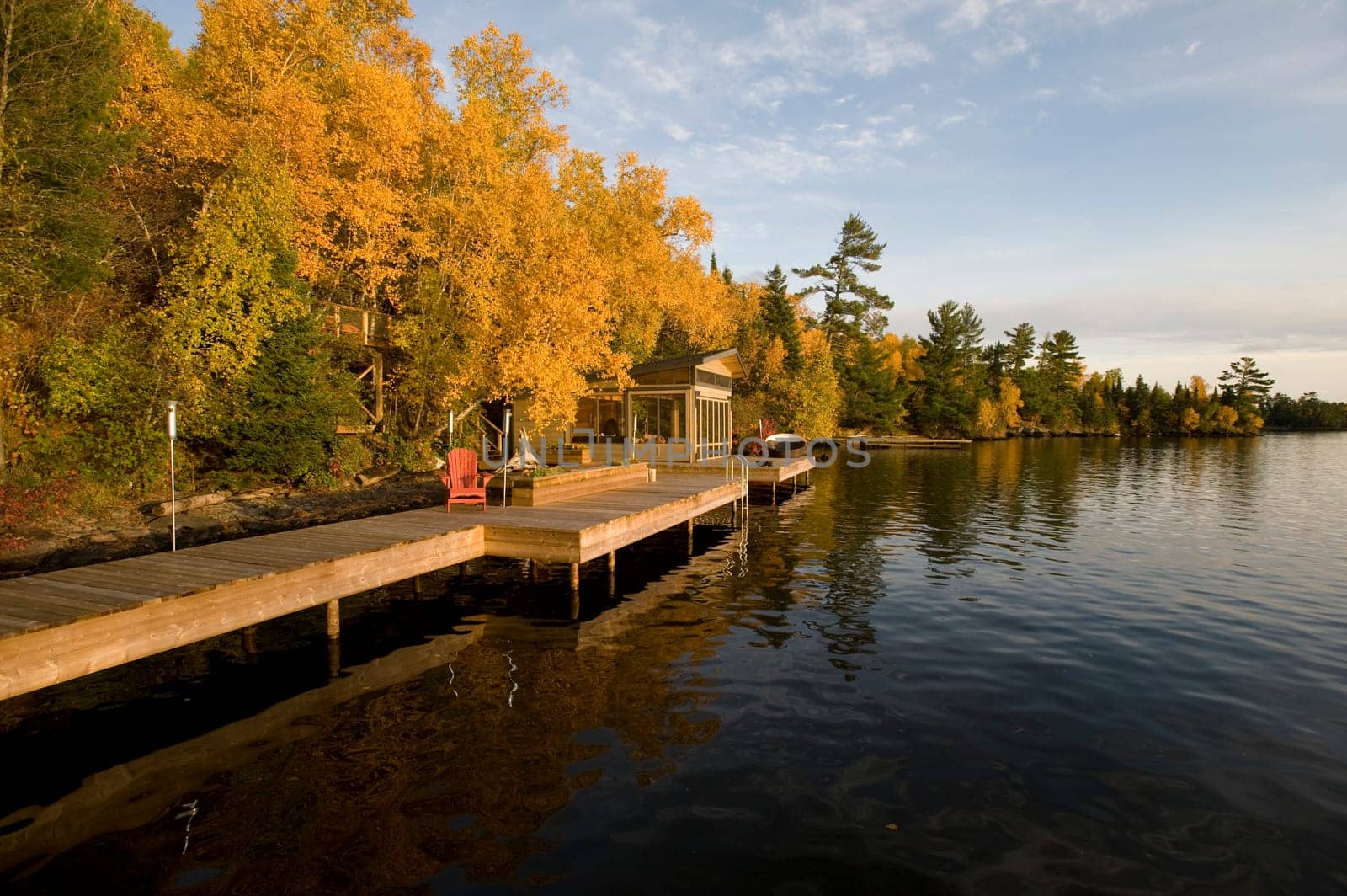 Cottage dock and autumn foliage, Lake of the Woods, Ontario, Canada