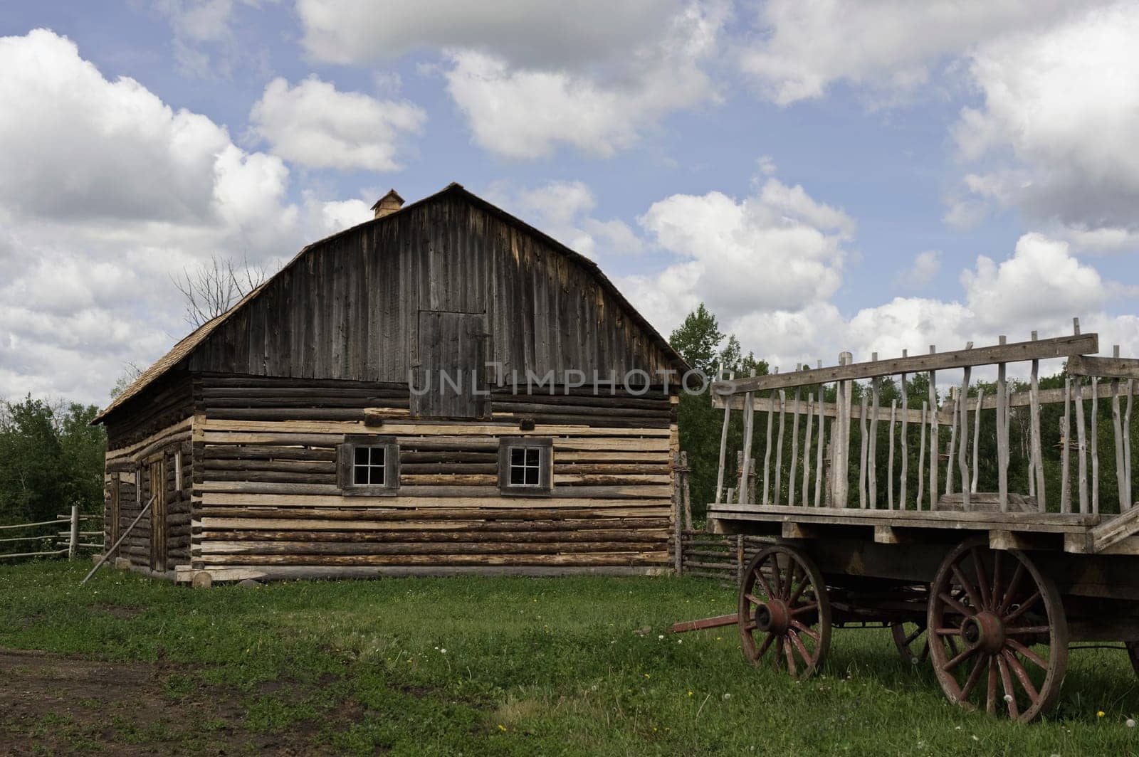 Old fashioned wagon and wood barn