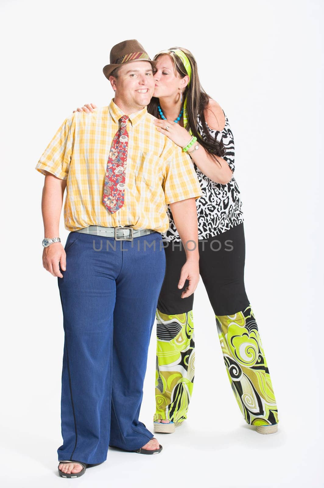 Couple dressed in 1970's clothing