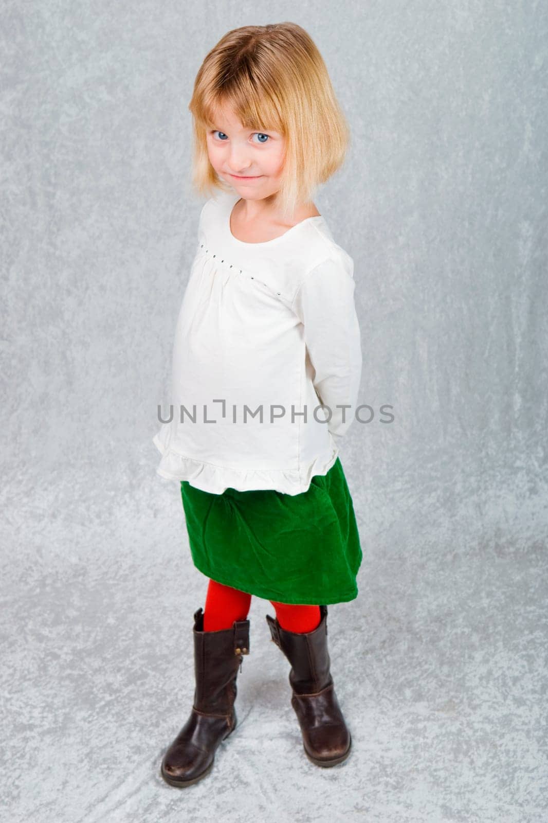 a young girl dressed for christmas