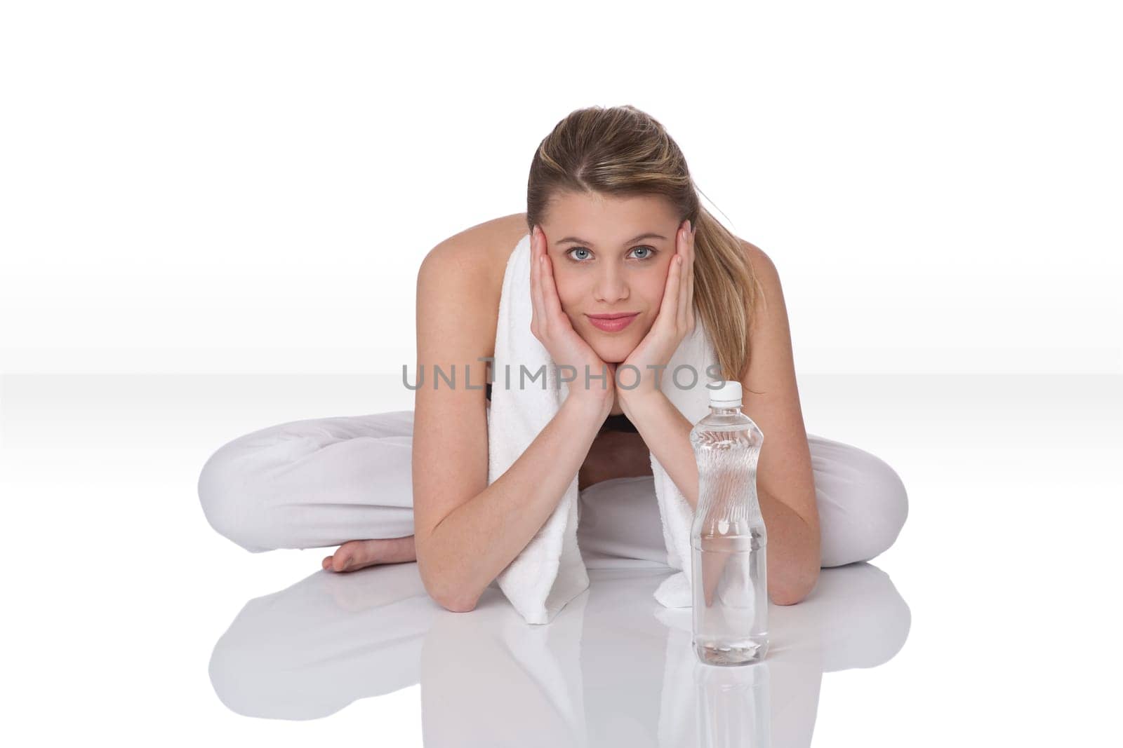 Fitness - Young sportive woman with water and towel