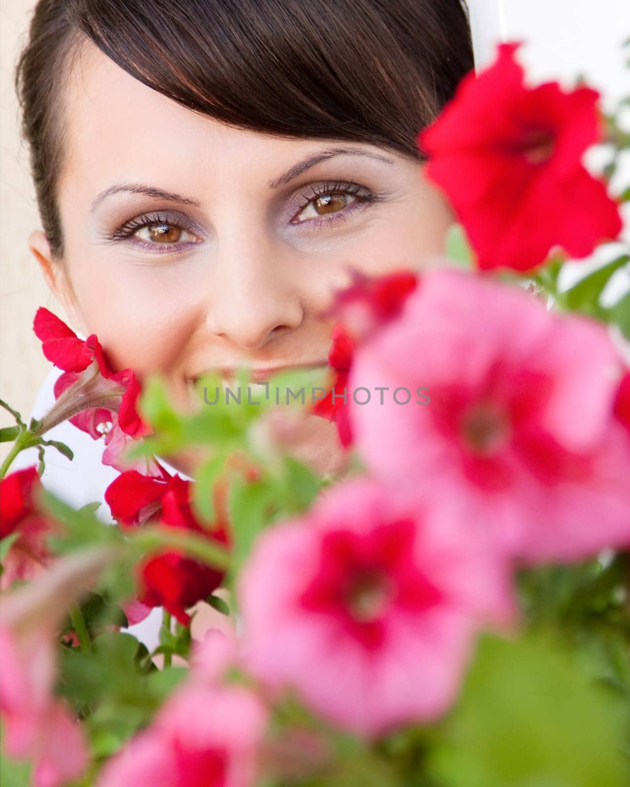 Attractive young woman face with flowers