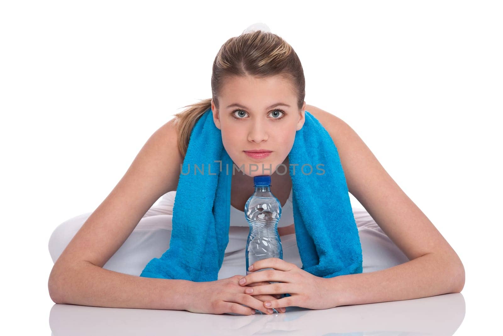 Fitness - Young sportive woman with water and towel