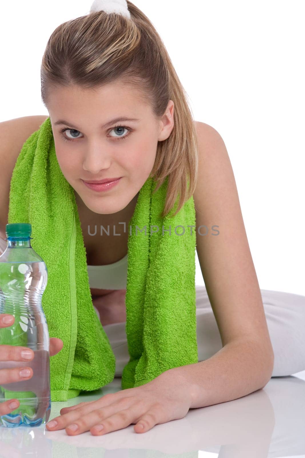 Fitness - Young sportive woman with water and towel