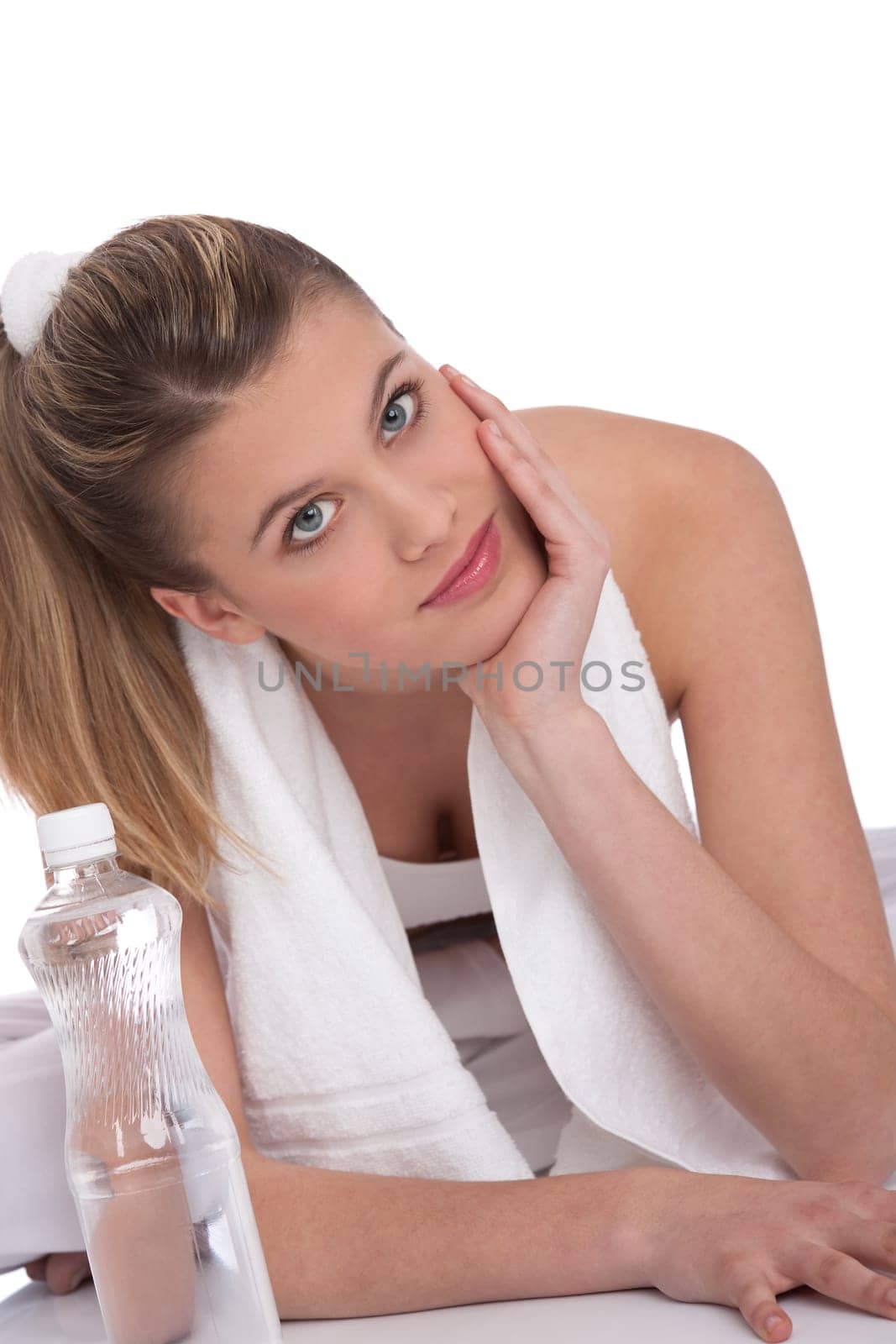 Fitness - Young sportive woman with water and towel