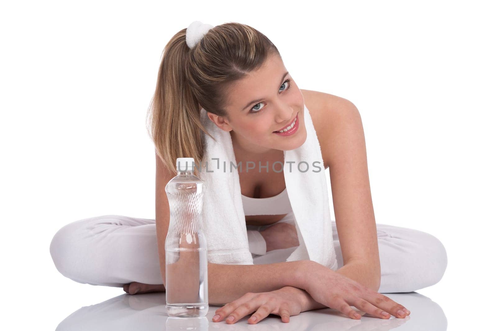 Fitness - Young sportive woman with water and towel