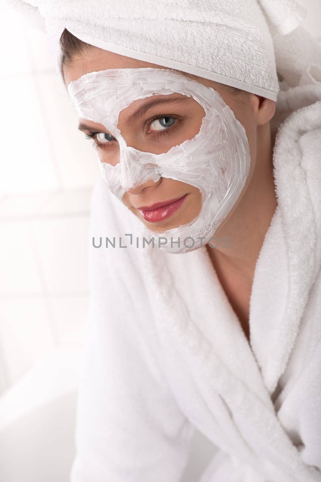 Body care - young woman with facial mask