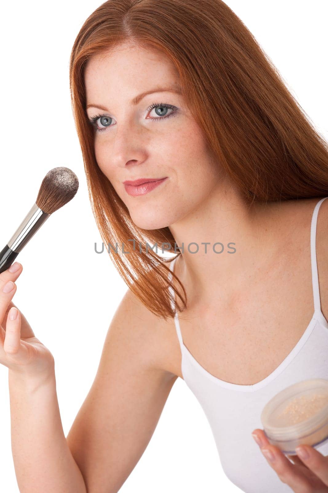 Body care - red hair woman apply powder
