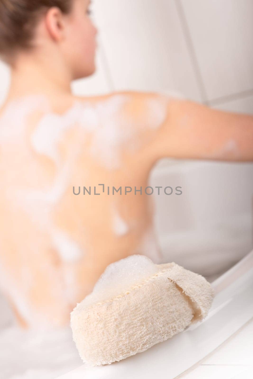Body care series - Woman lying in bathtub