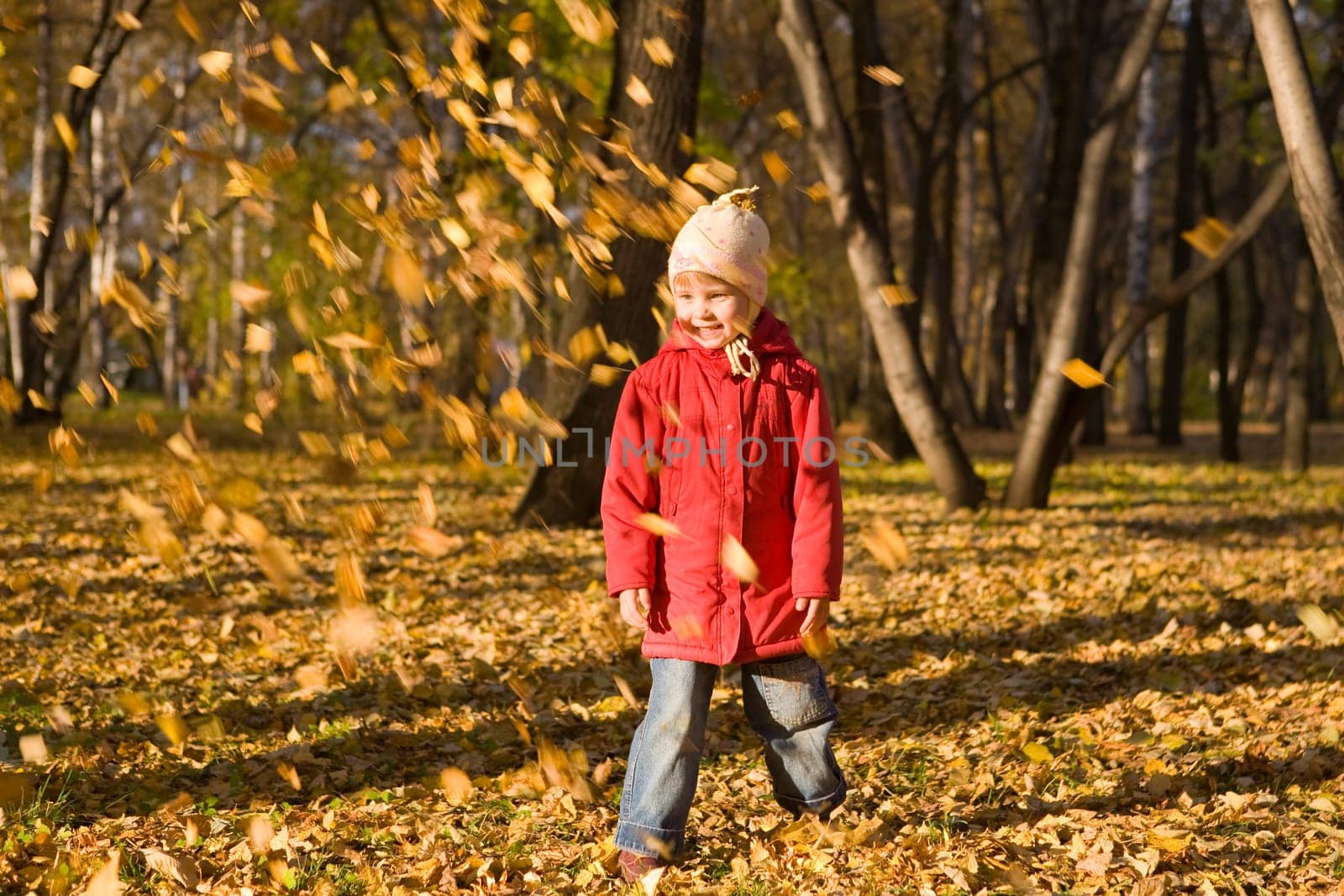 Children throw autumn leaves 2