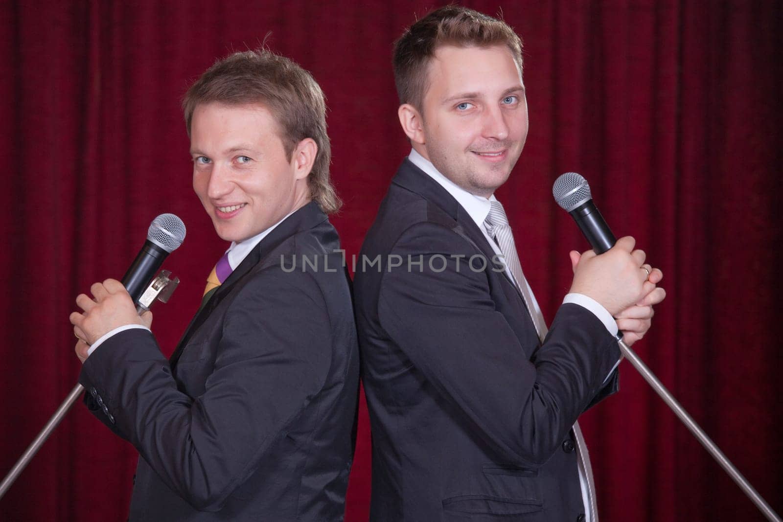 two men with microphones