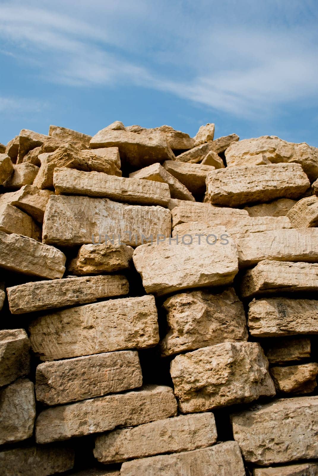 Stacked pile of bricks  under the sky
