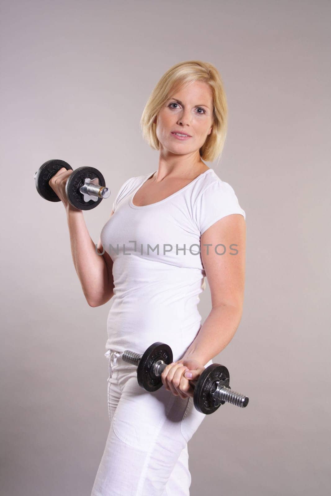 Woman with dumbbells