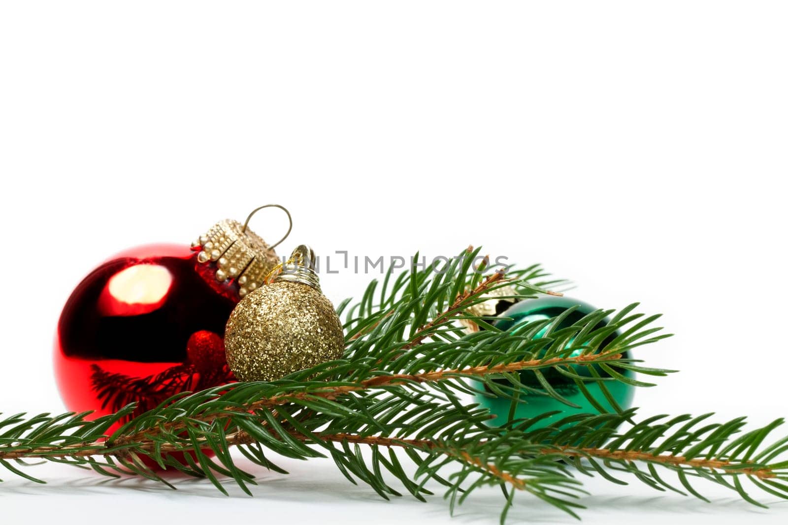 Three baubles between branches