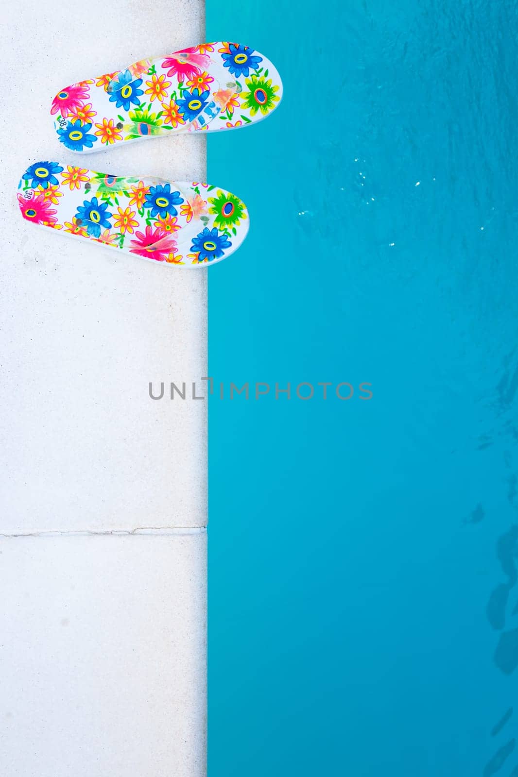 flip-flops near the swimming-pool