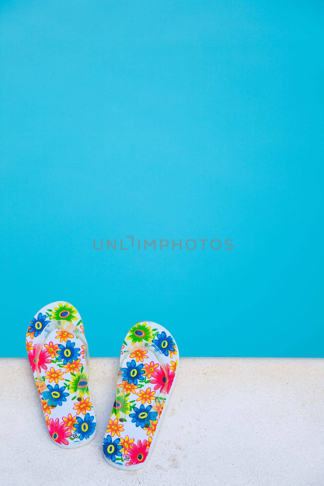 flip-flops near the swimming-pool