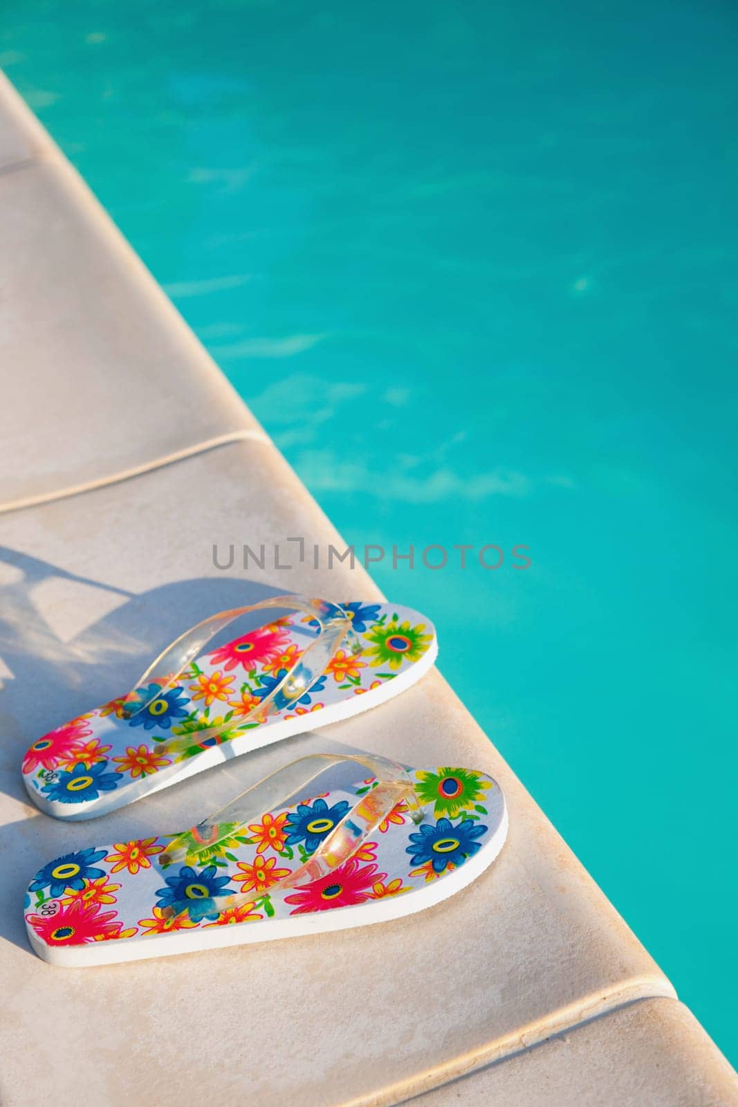 flip-flops near the swimming-pool