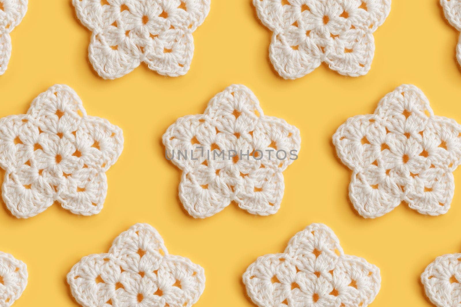 The white crocheted star on a bright background with copy space / pattern by Gudzar