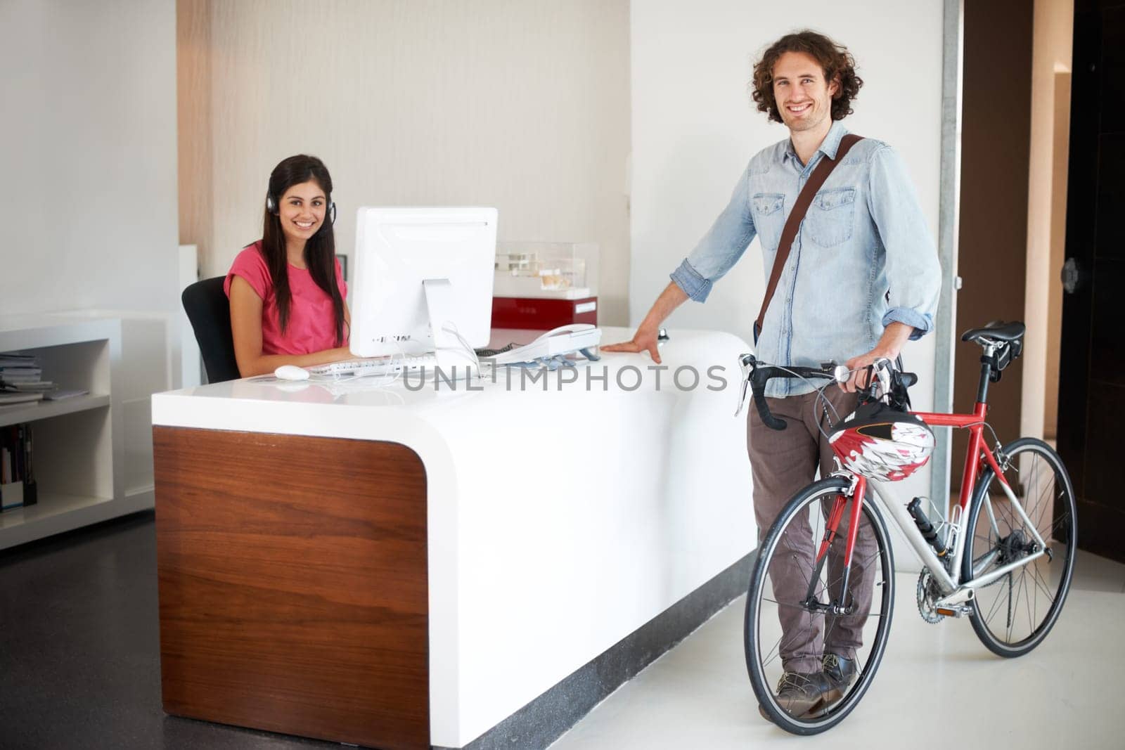 Man, office with bike and sustainable travel, worker in portrait with carbon footprint, transportation and creative at startup. Happy, cycling for eco friendly commute and professional at workplace by YuriArcurs
