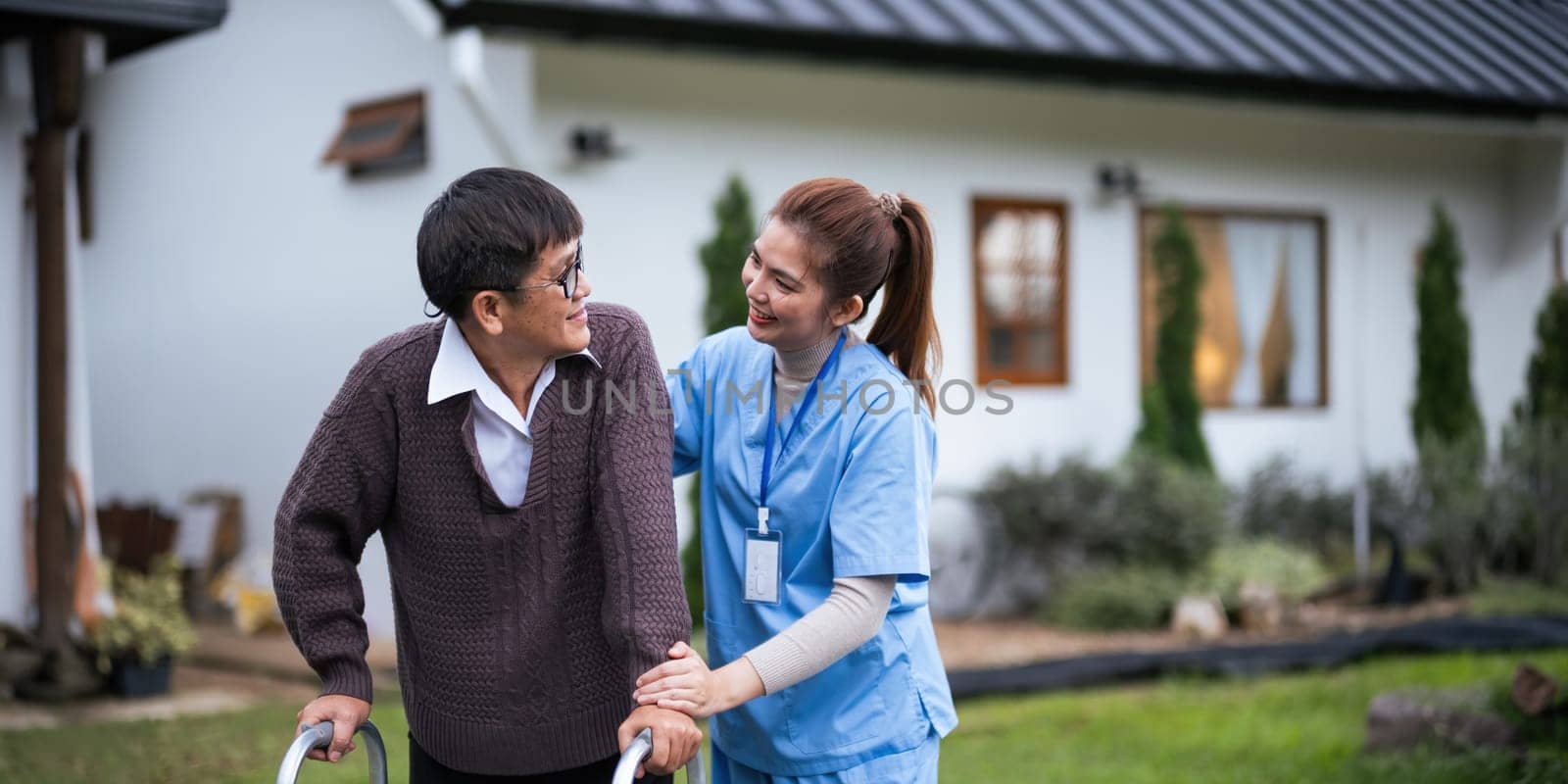 Nurse or caregiver hand on walking frame for support, help or trust moving leg in rehabilitation. Physiotherapy healthcare, Medical caregiver consulting disabled elderly patient at home.