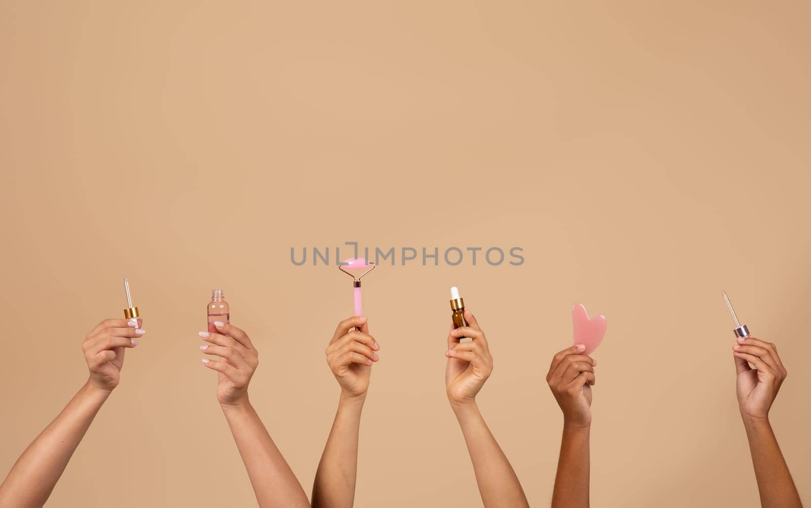 Hands of diverse multiracial women gracefully present an array of beauty products, highlighting the collective charm and unity in diversity, copy space