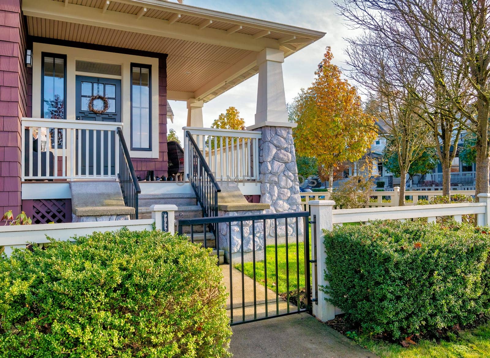 A perfect neighbourhood. Main entrance and front yard of a luxury residential house.