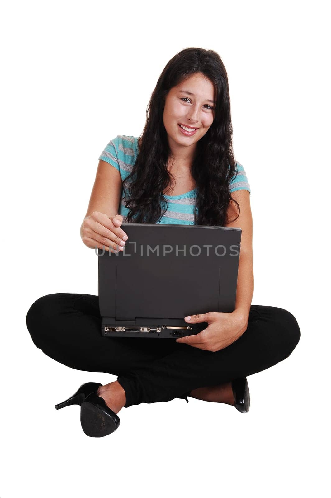 Girl sitting with laptop on floor.