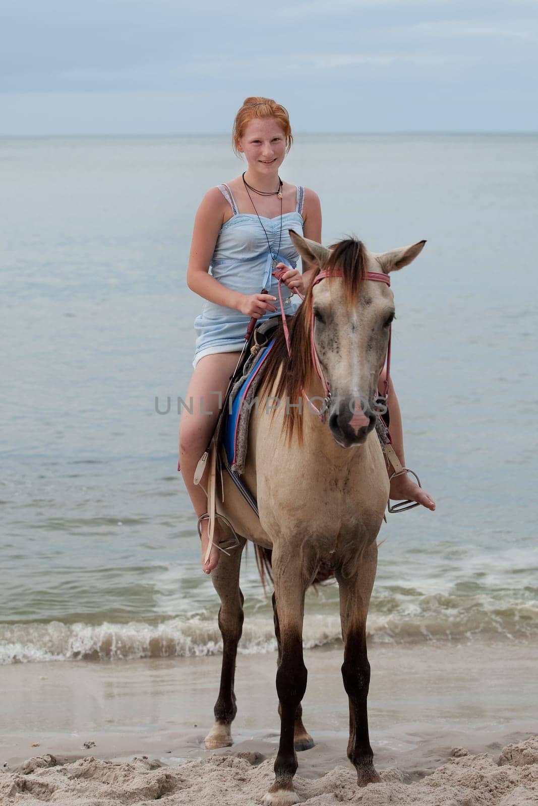 Girl rides horse