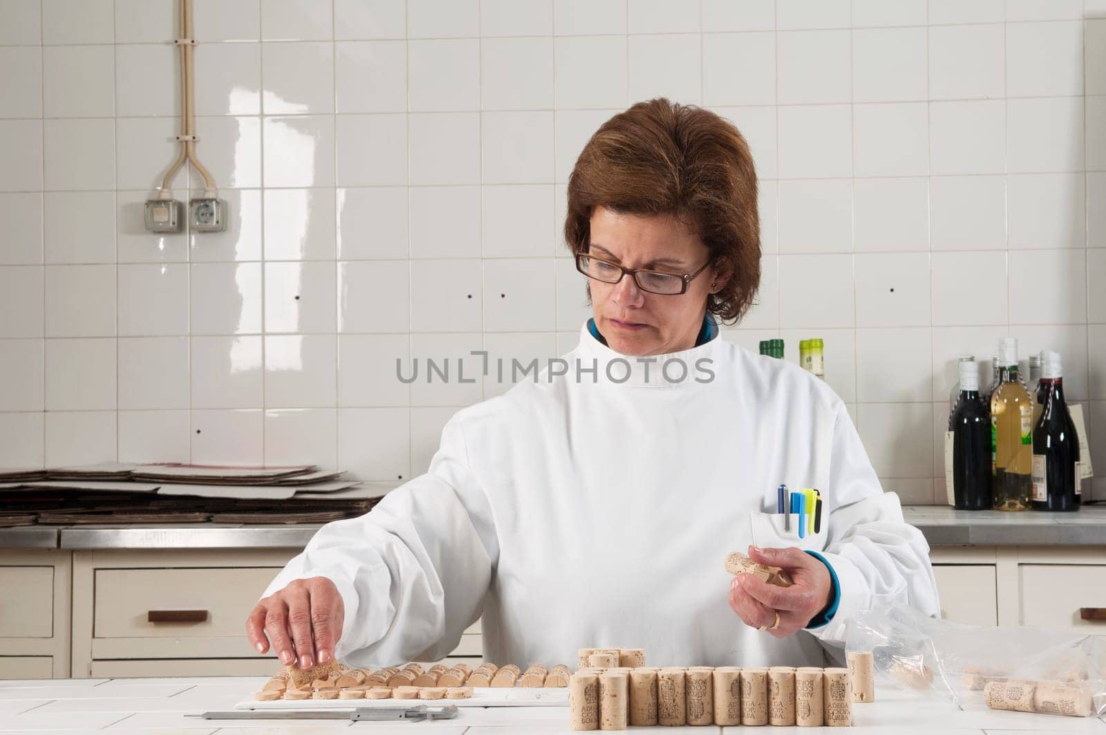Woman checking cork stoppers